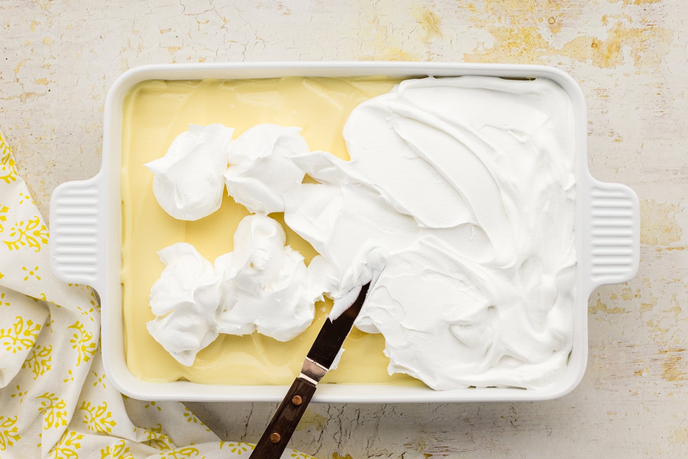 whipped cream spread over dessert