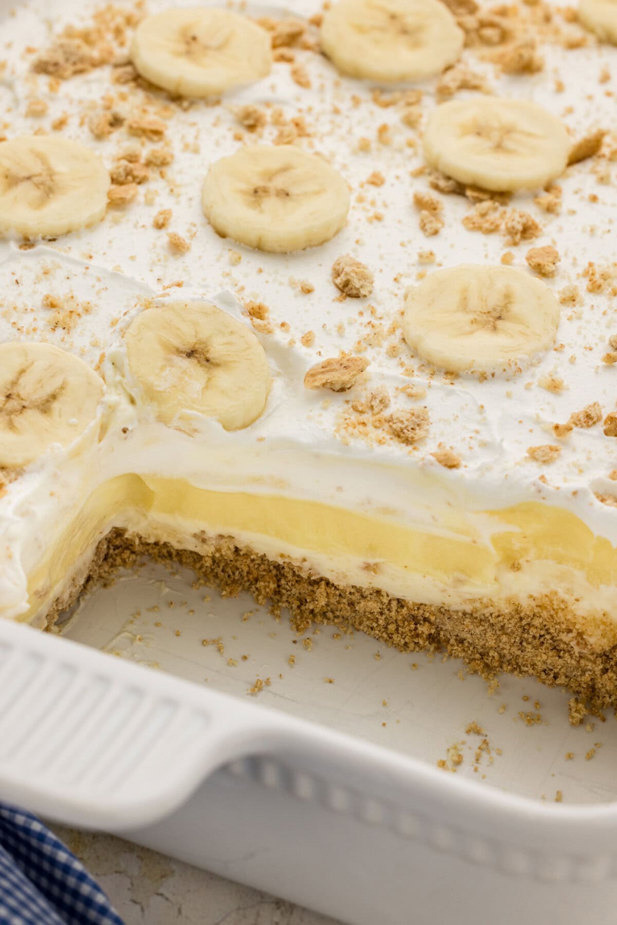 pan of Banana Cream Lush with a couple slices removed