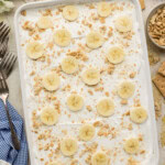 overhead view of a pan of Banana Cream Lush with banan slices on it