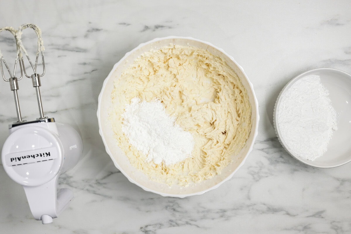 powdered sugar in a bowl with cream cheese frosting