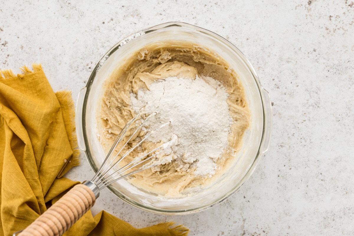 Mixing flour into dough in a bowl