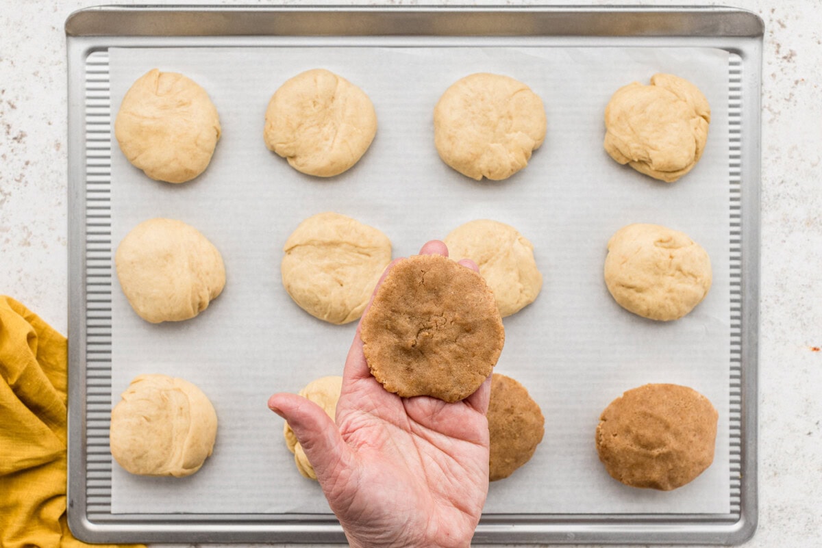 Hand holding Mexican sweet bread topping