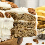 Close up photo of a slice of Hummingbird Cake being removed