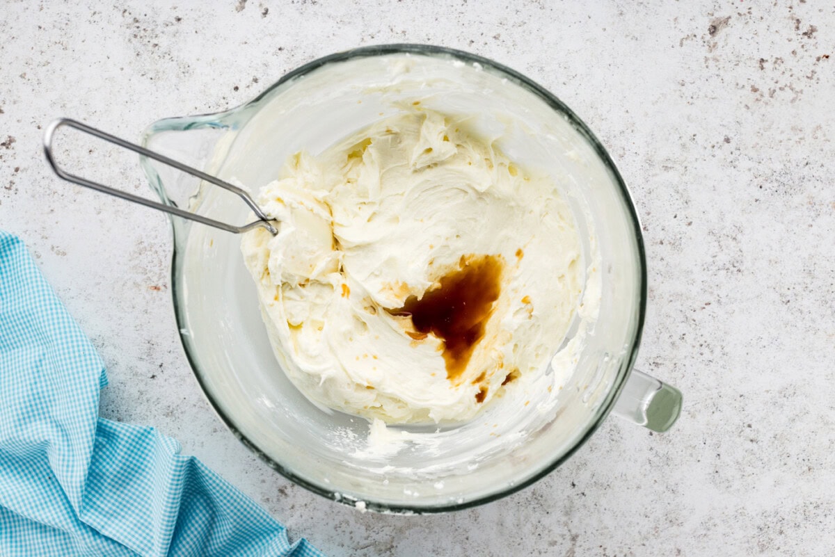Vanilla and salt added to bowl of cream cheese frosting