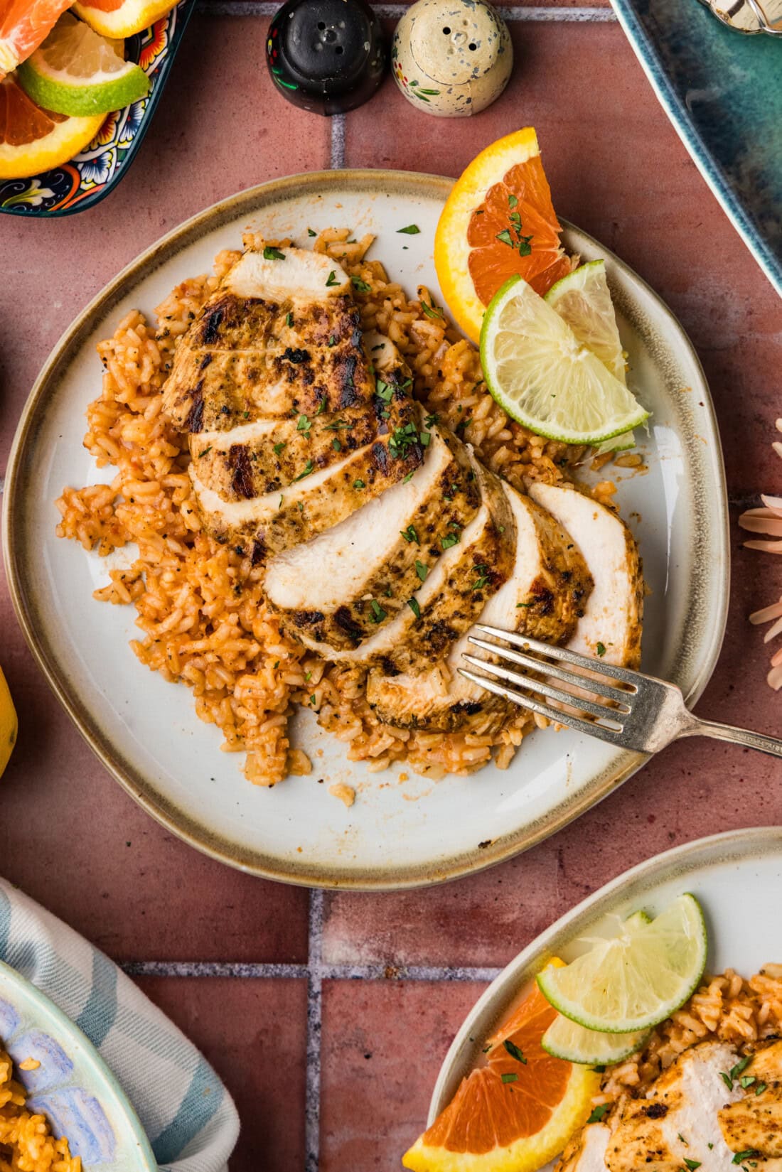 sliced baja chicken on a bed of Mexican Rice