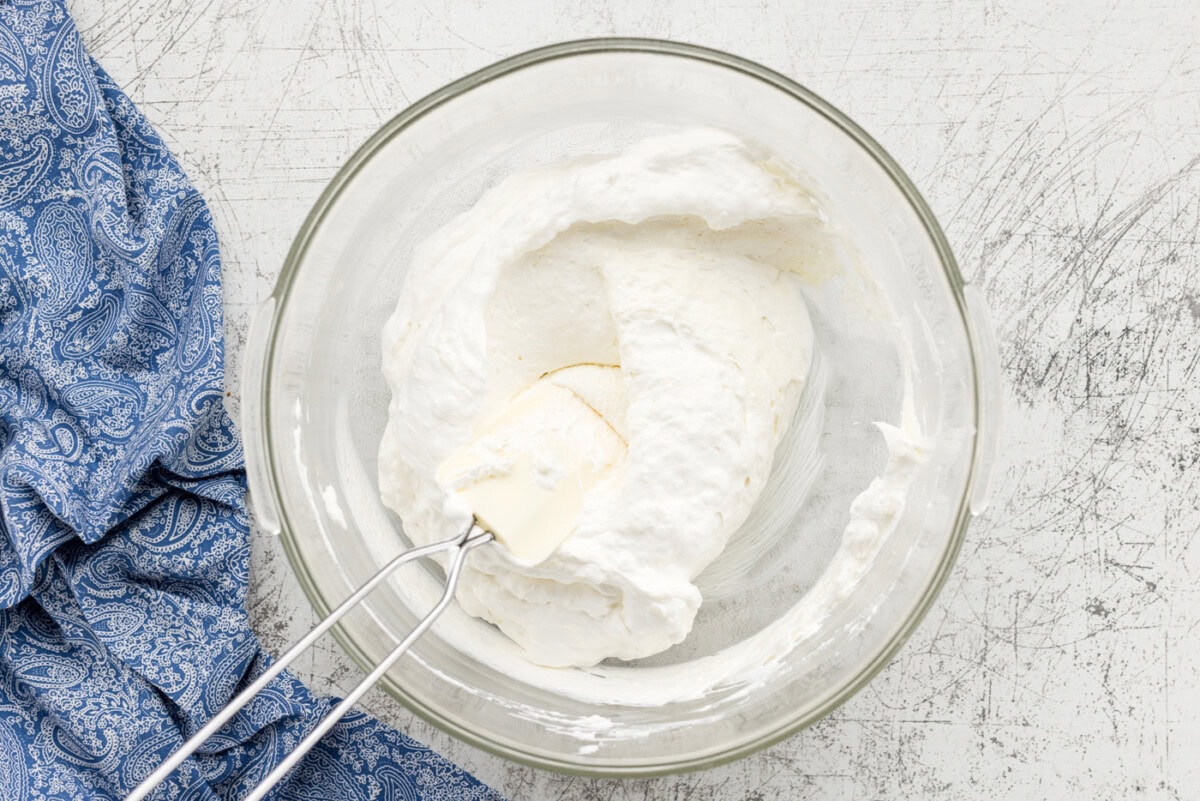 whipped cream and cream cheese combined in bowl