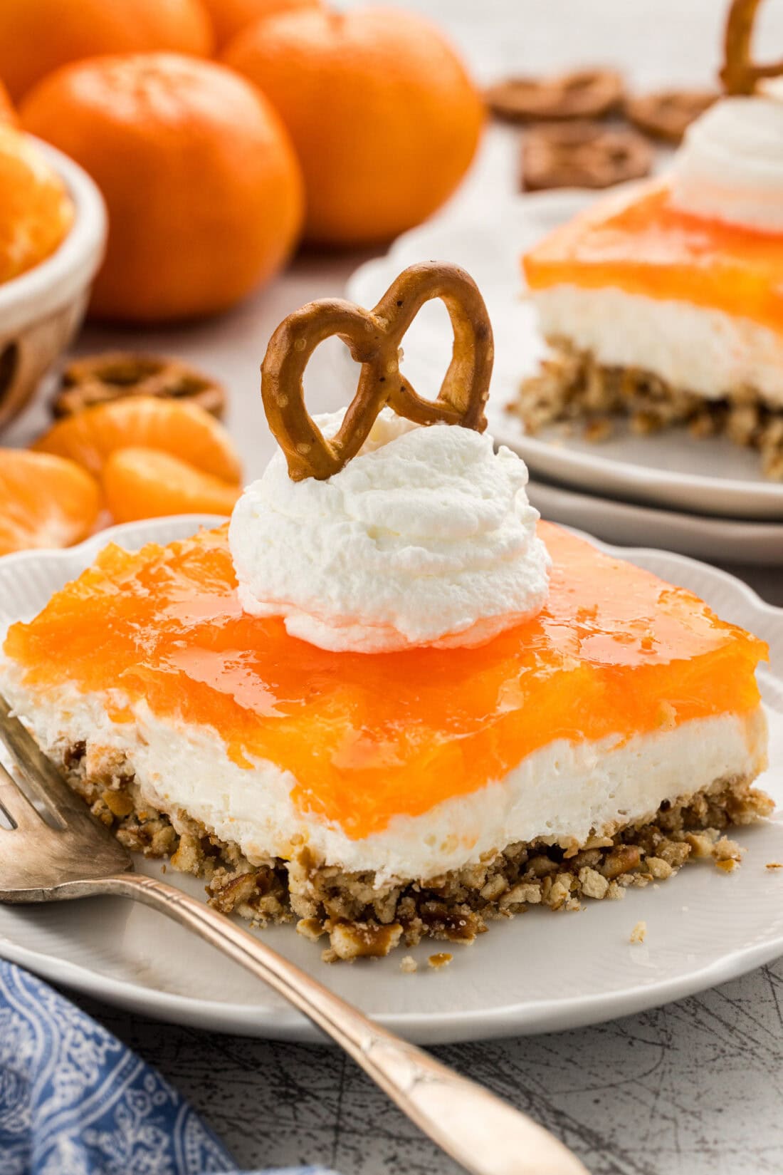 slice of Orange Pretzel Salad with whipped cream