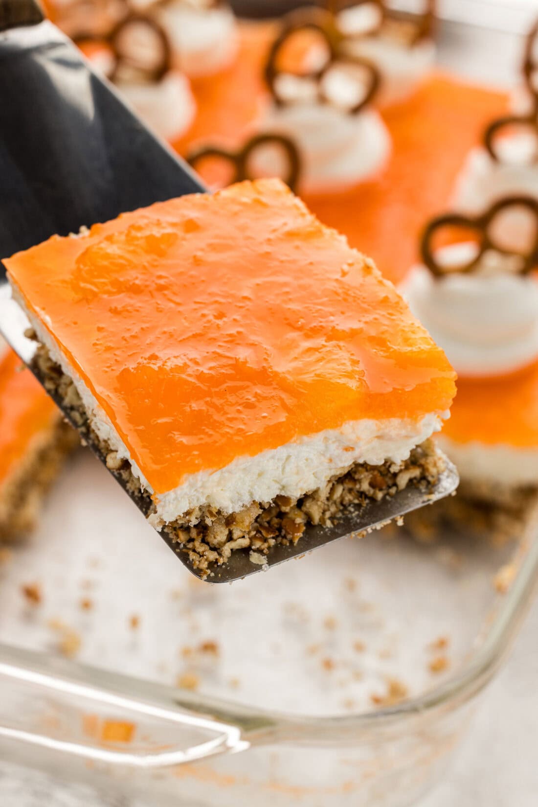 slice of Orange Pretzel Salad on spatula