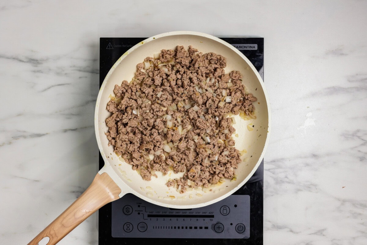 ground turkey browned in a skillet with onion