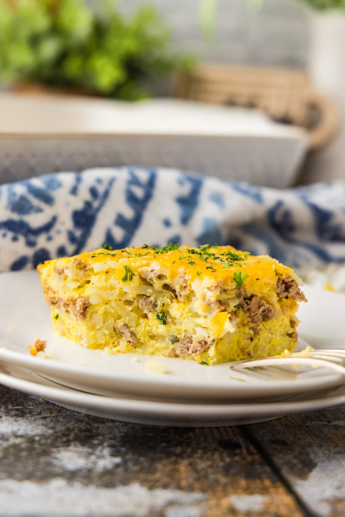 slice of Turkey Hash Brown Breakfast Casserole on white plate