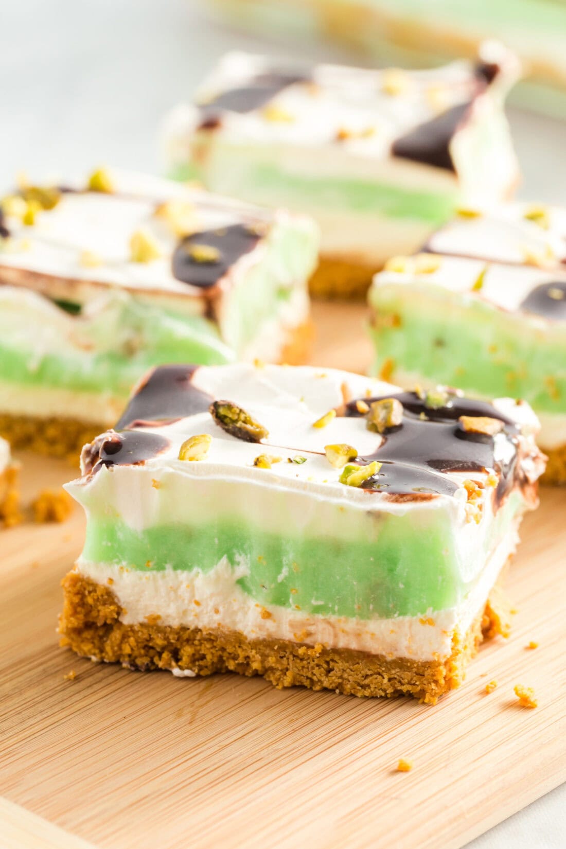 Slices of Pistachio Lush on a wooden board