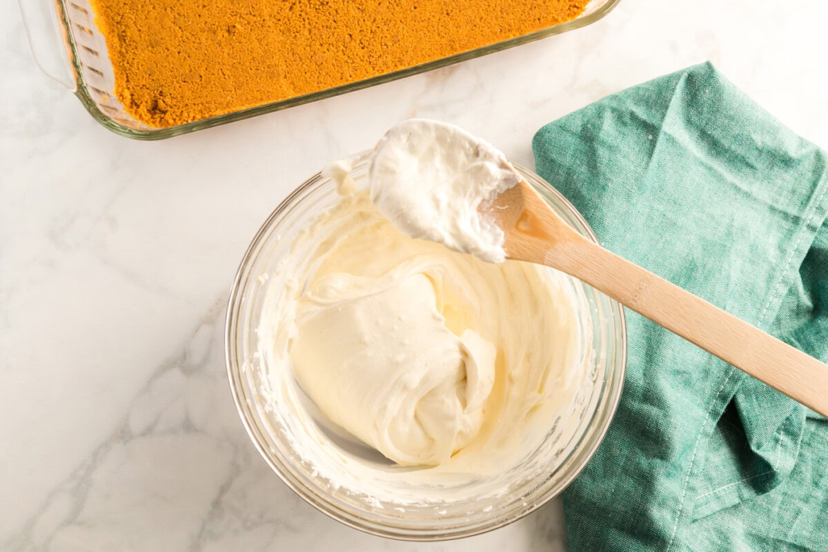 cream cheese and cool whip mixed in a bowl