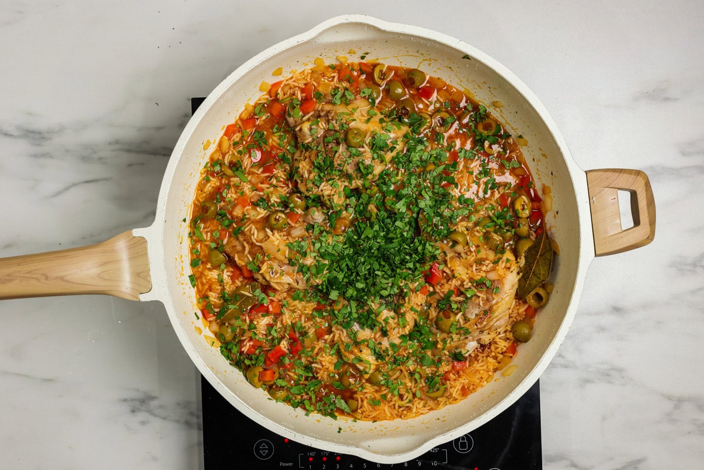 chopped cilantro added to skillet
