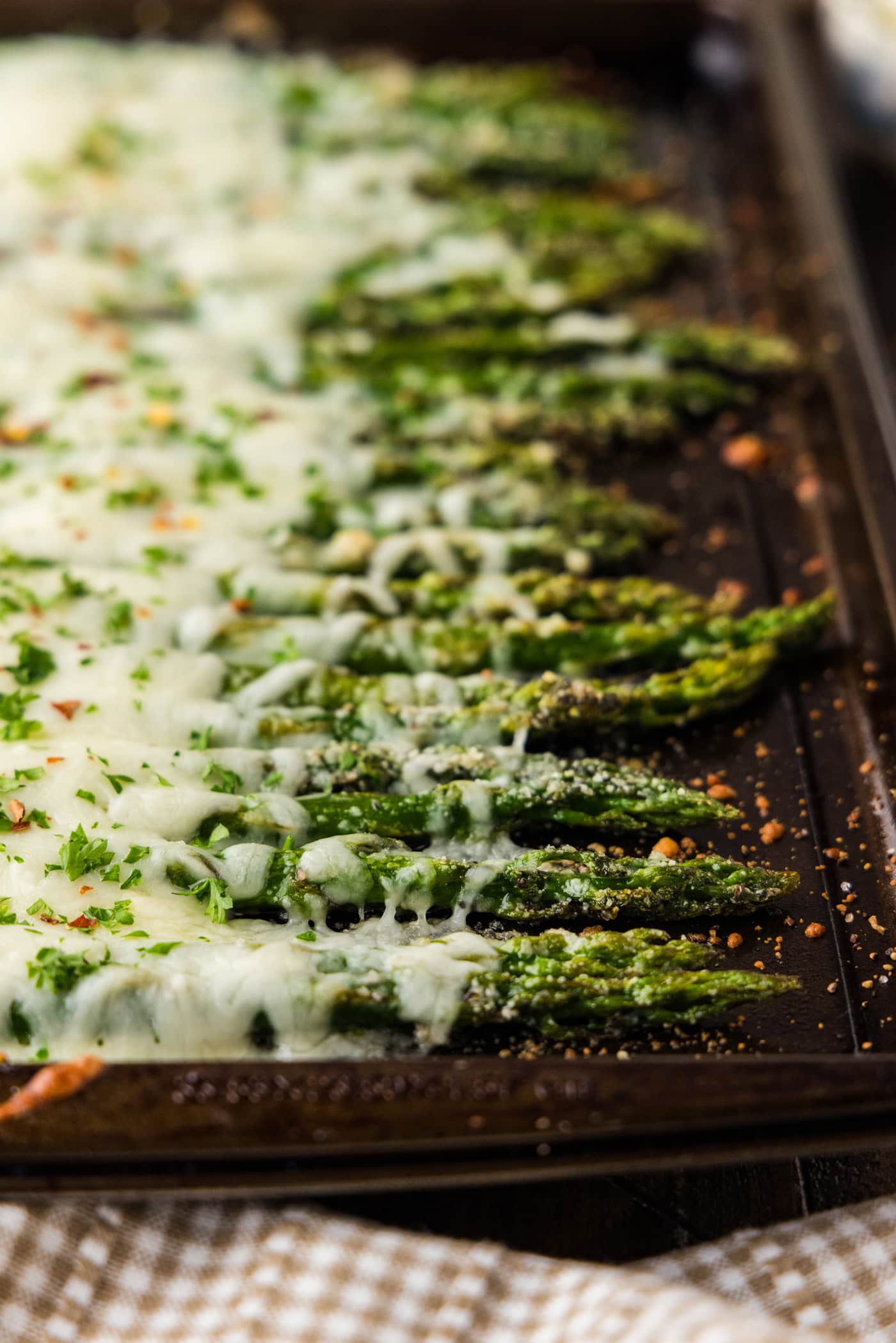 close up of Cheesy Asparagus on pan