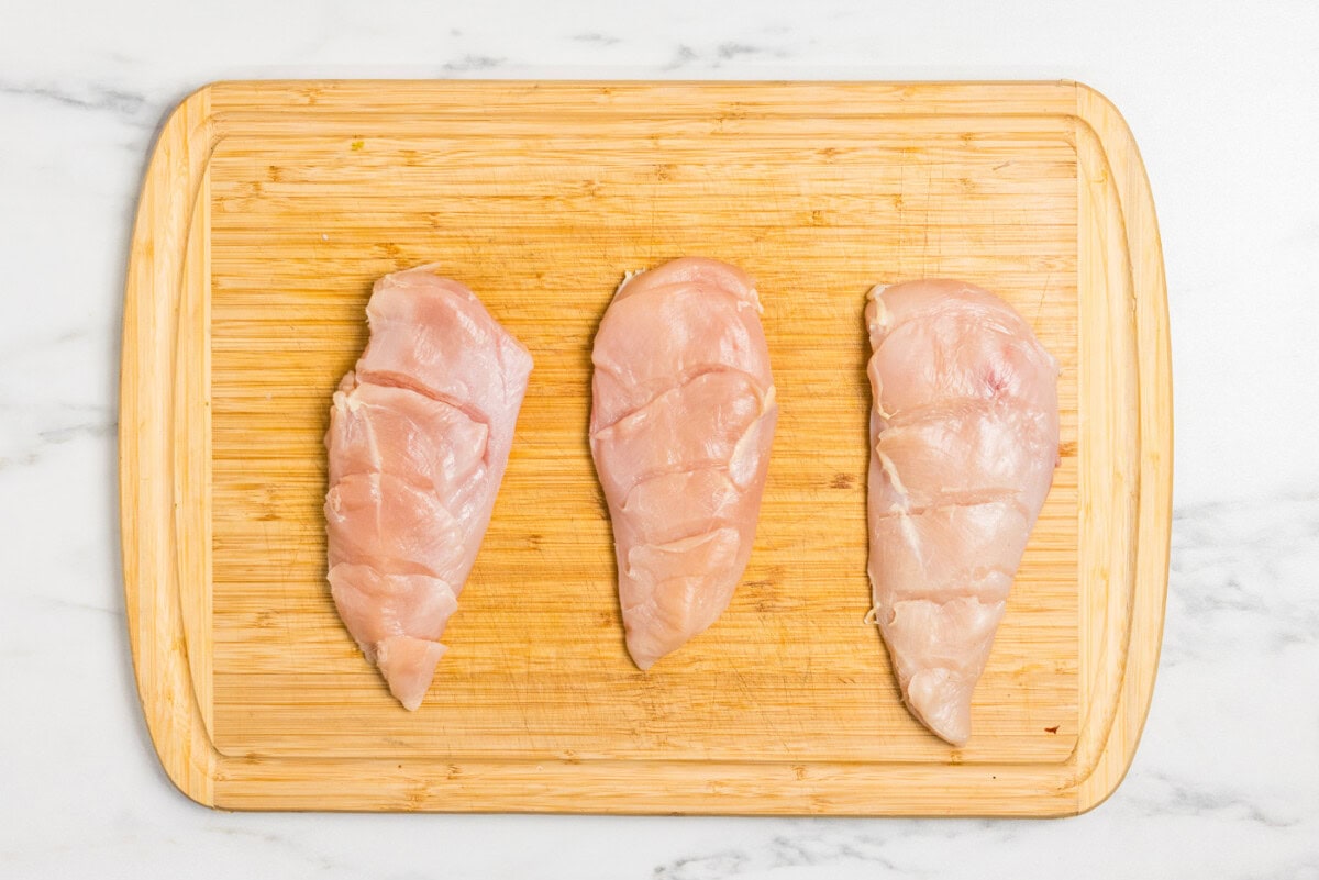 chicken breasts on cutting board
