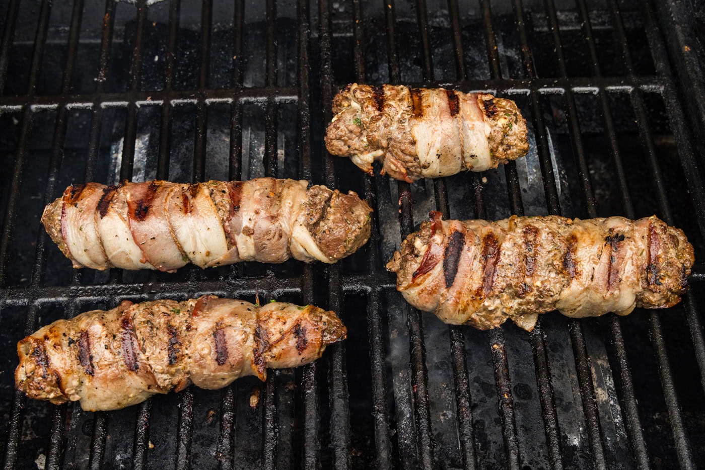 bacon wrapped cube steaks on the grill