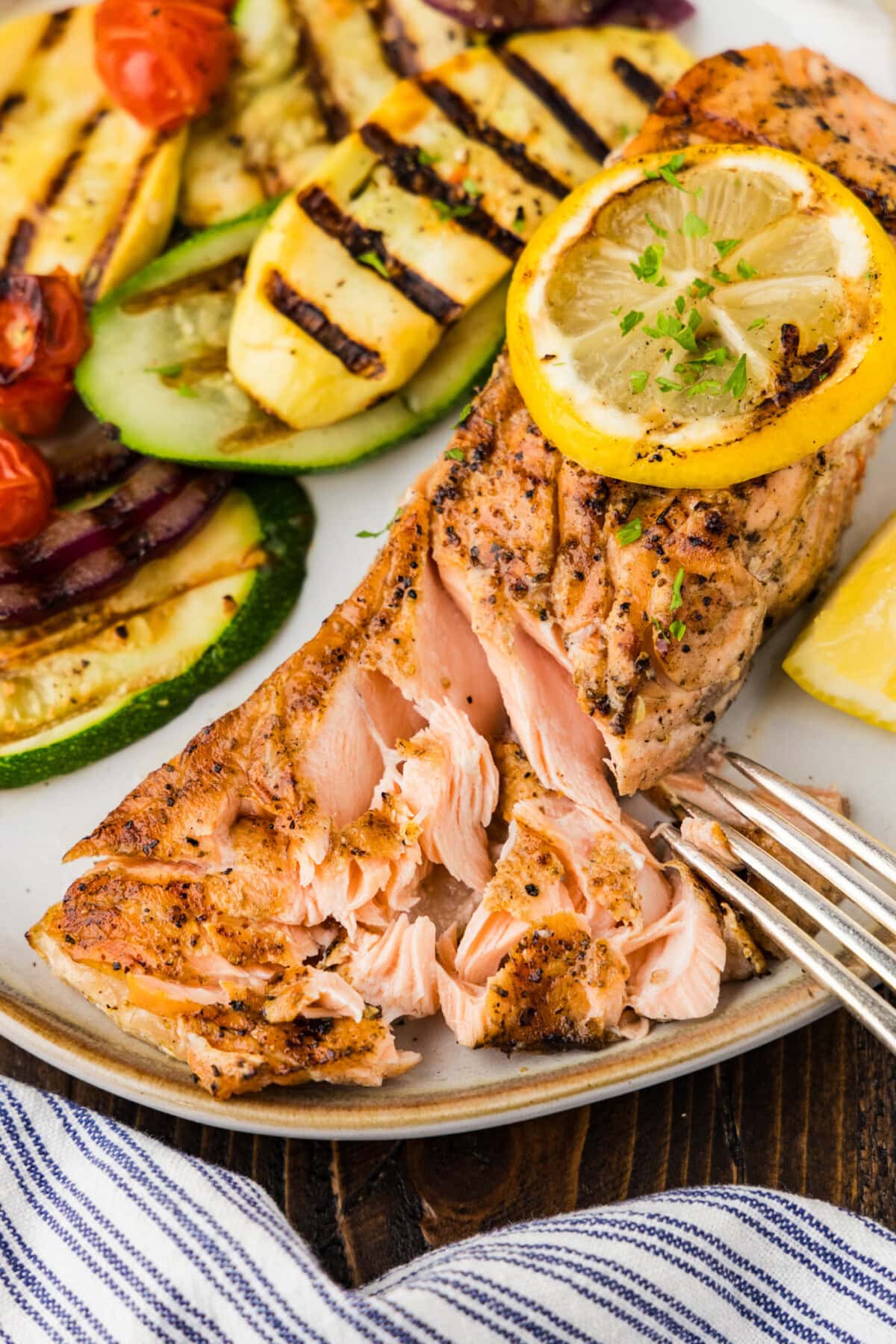 Grilled Lemon Salmon broken open with fork