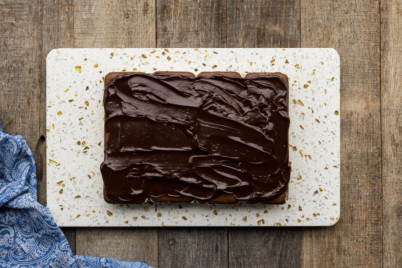hot fudge spread across ice cream sandwiches