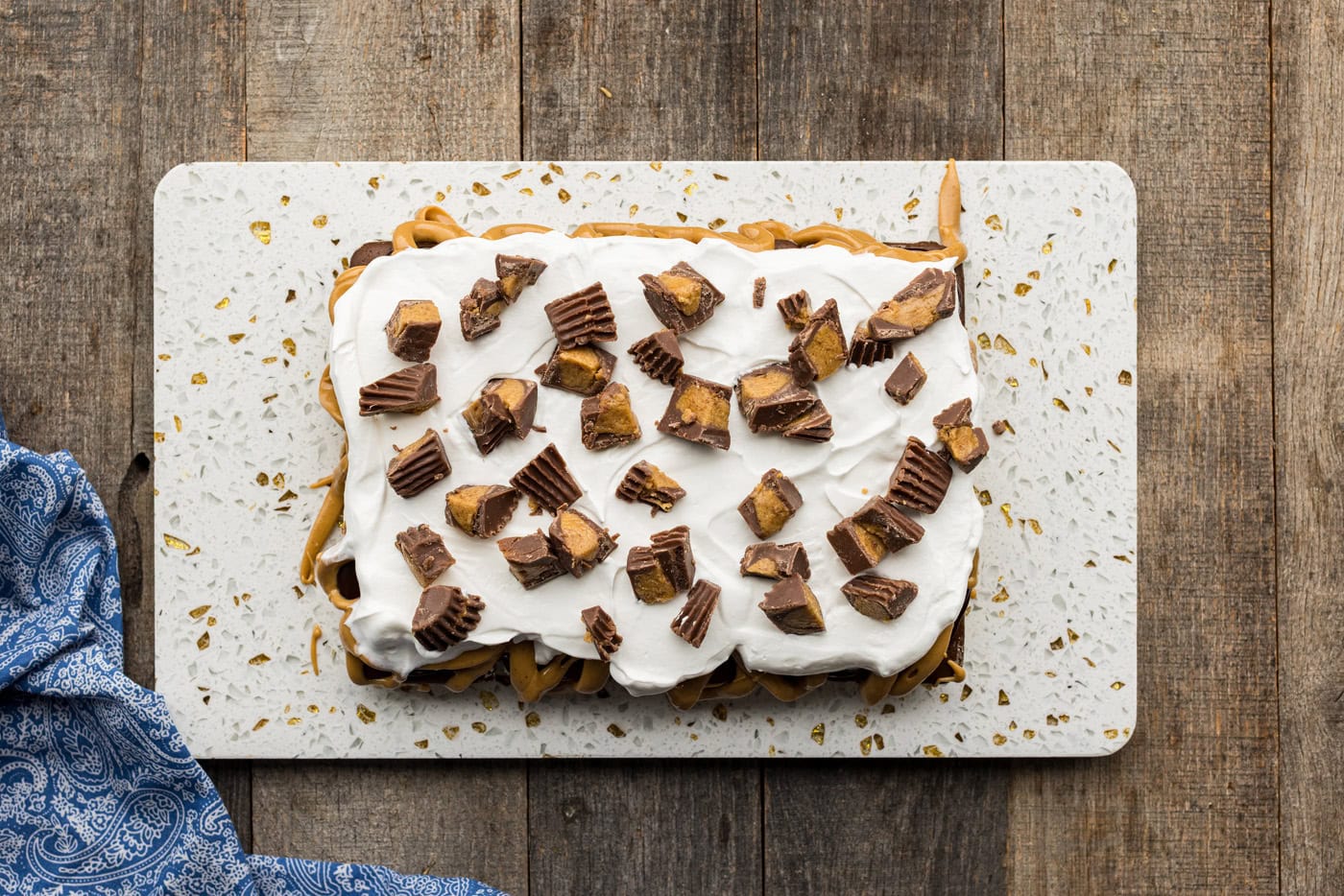 top of ice cream sandwich cake dotted with chopped peanut butter cups