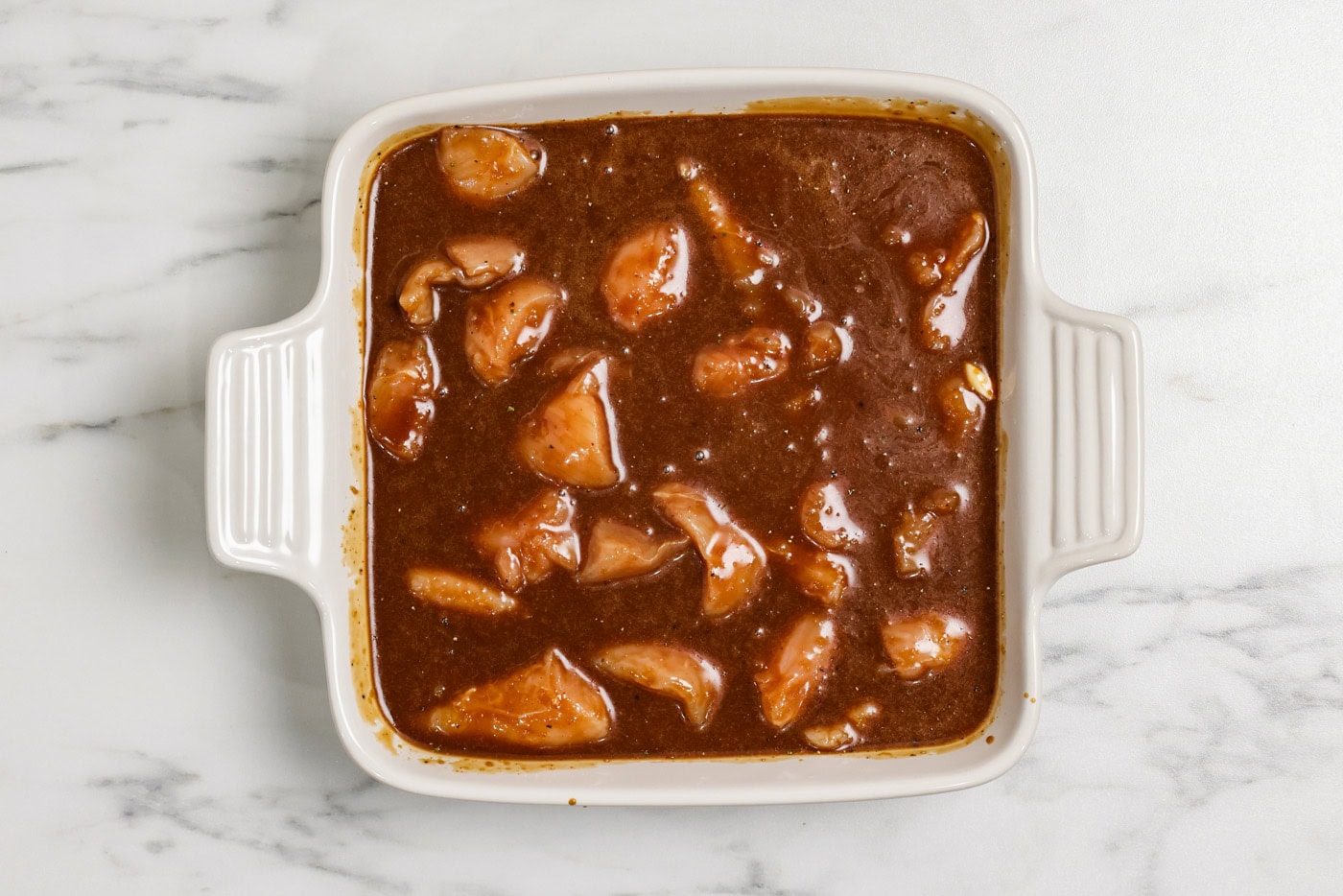 cubed chicken in marinade