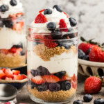 Close up No Bake Berry Cheesecake Trifle in Mason Jars