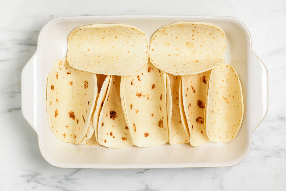 flour tortillas in a 13x9 pan