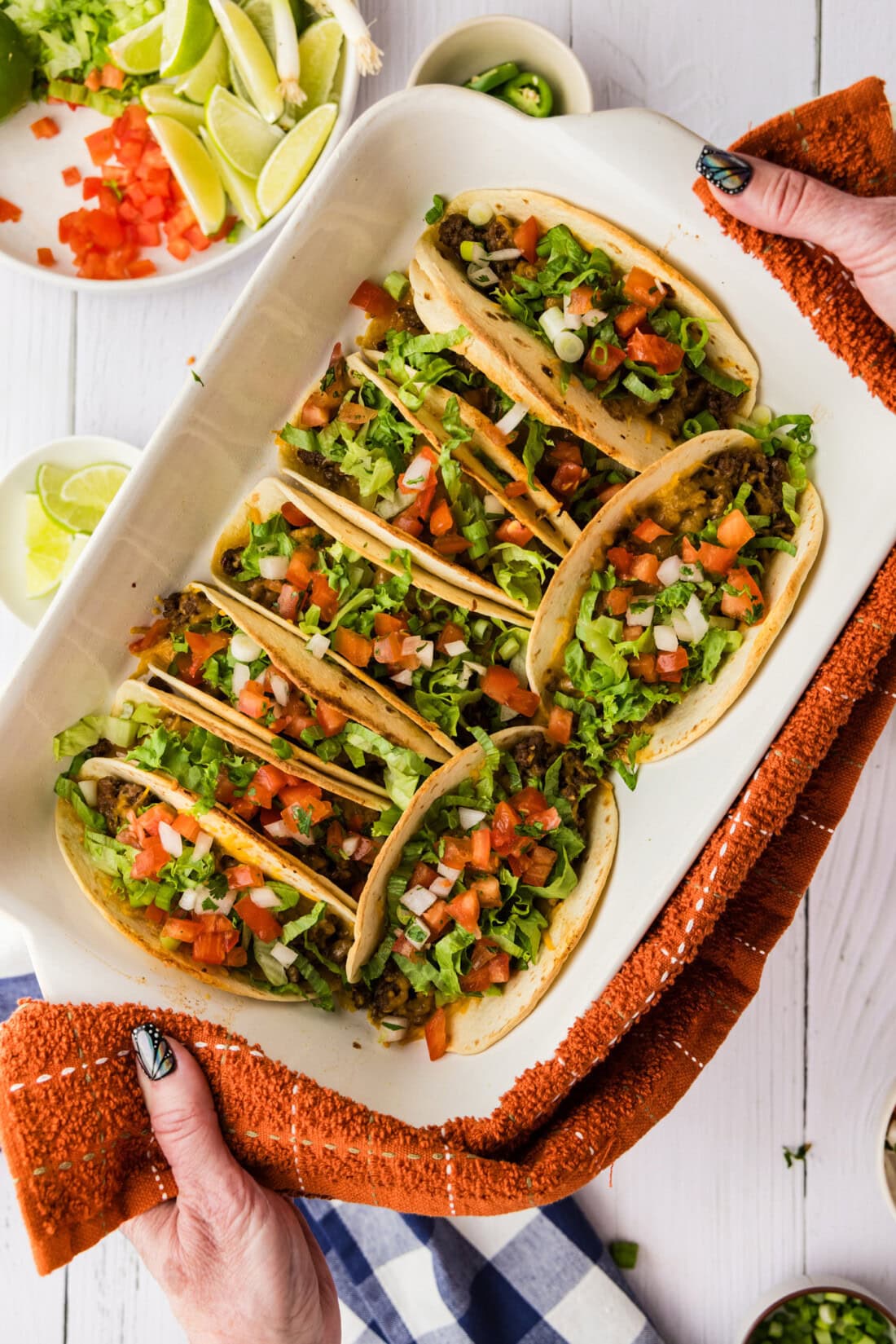overhead view of oven tacos with toppings