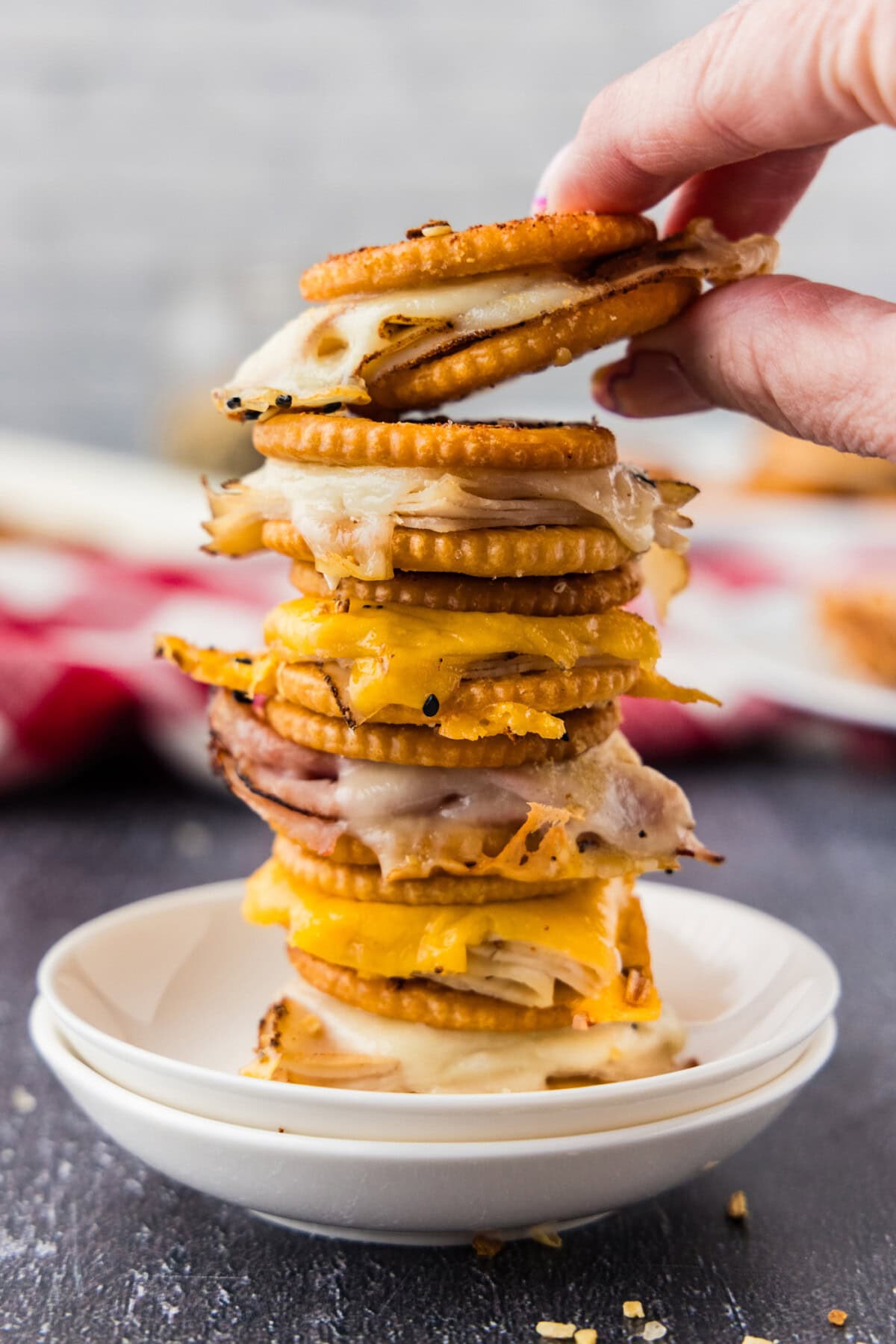 taking a Ritz Cracker Party Sandwich from a stack