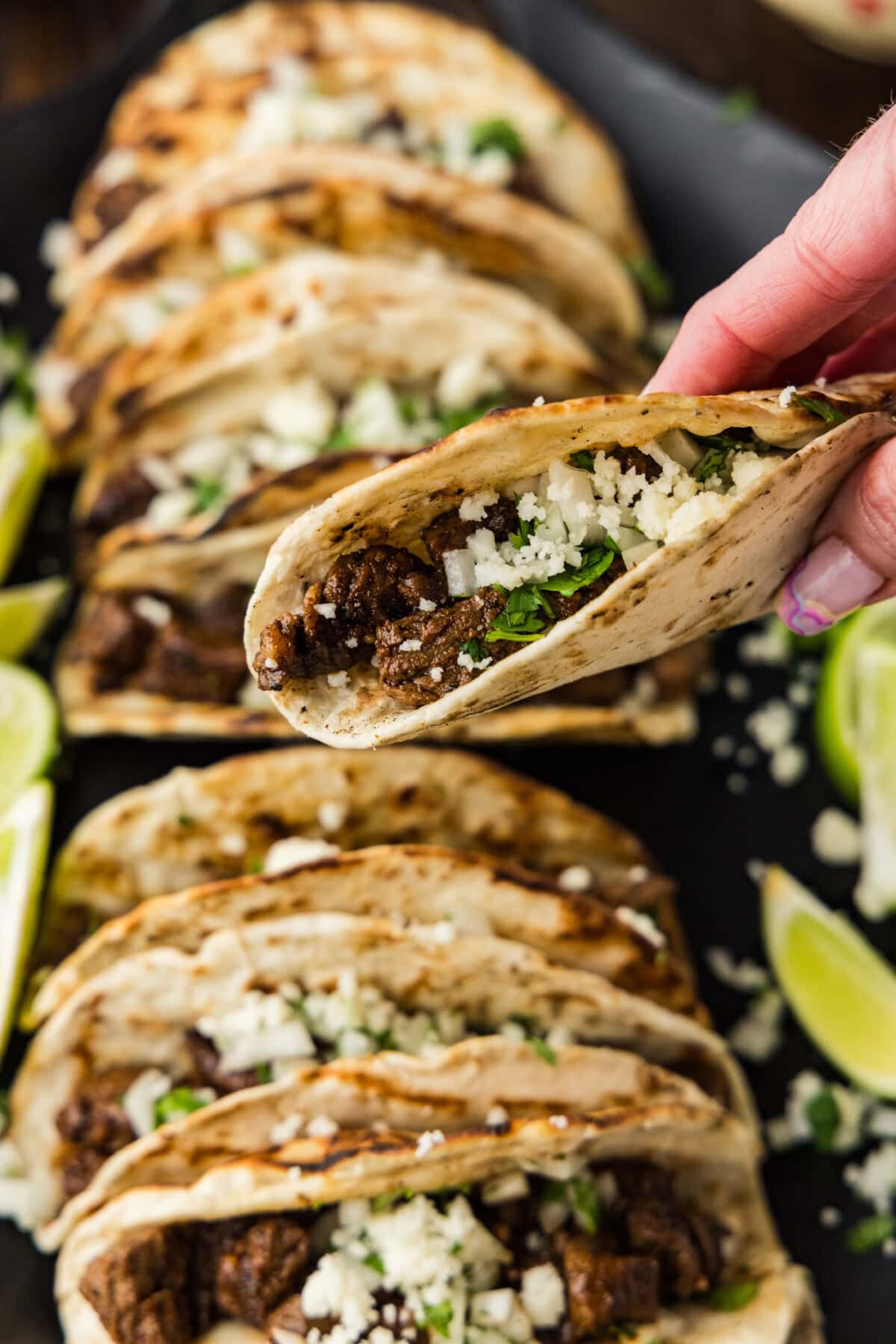 holding a Steak Soft Taco