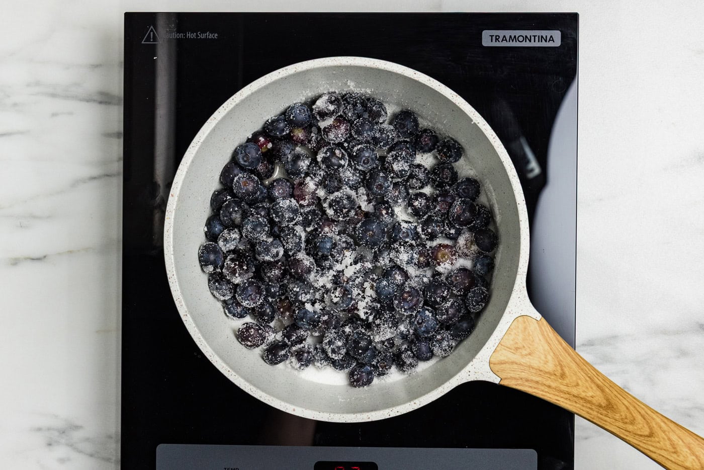 blueberries in saucepan with sugar