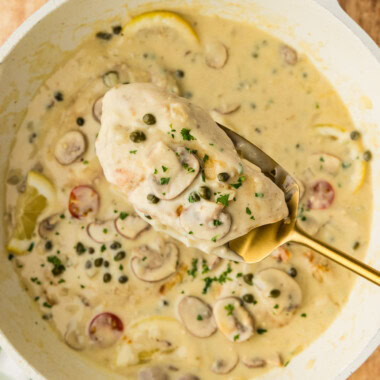 spatula lifting Chicken Scallopini from skillet