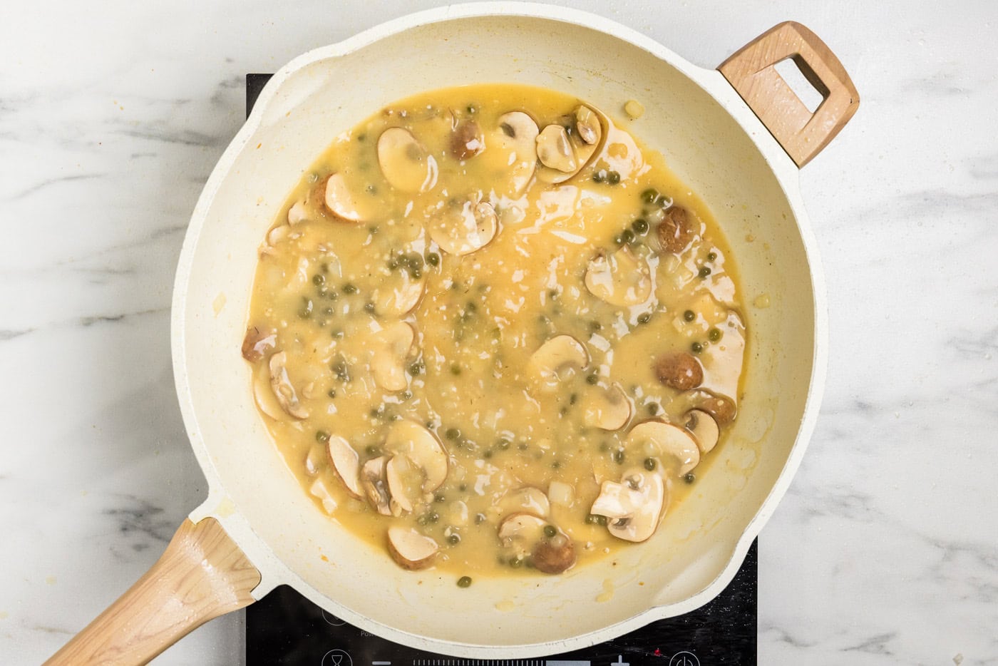 Chicken Scallopini sauce in skillet