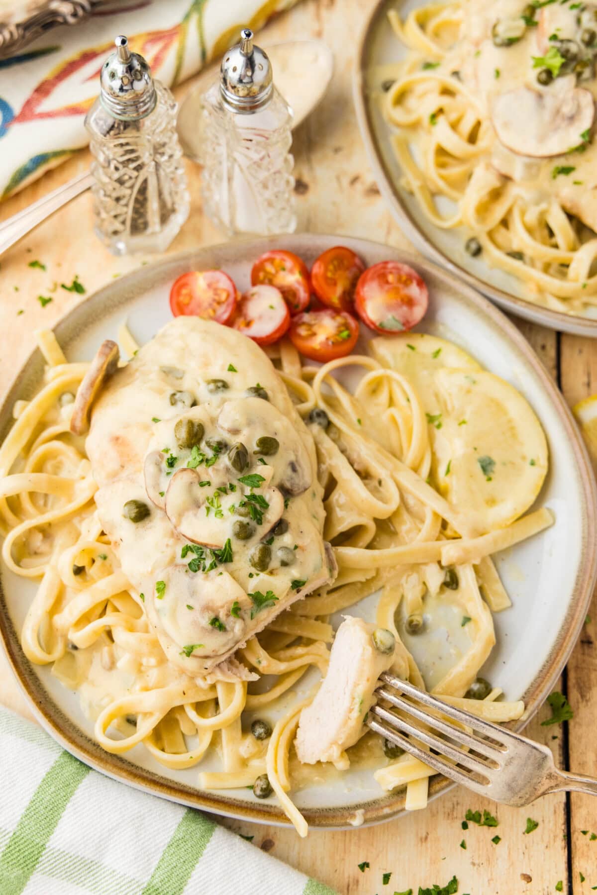 Chicken Scallopini on fettucini on plate