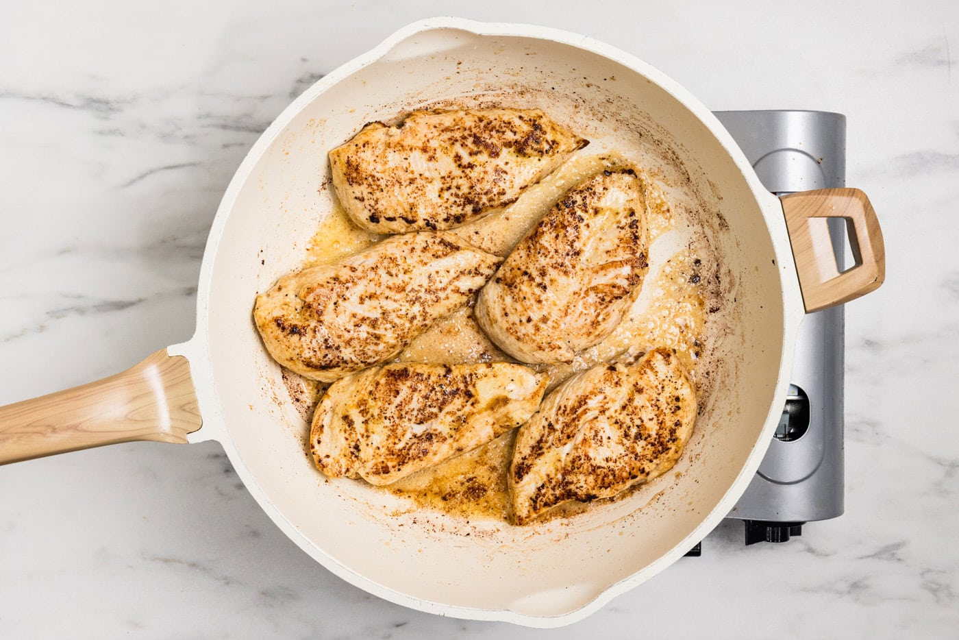browned chicken breasts in skillet