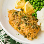 Crockpot Lemon Chicken on plate with potatoes and peas