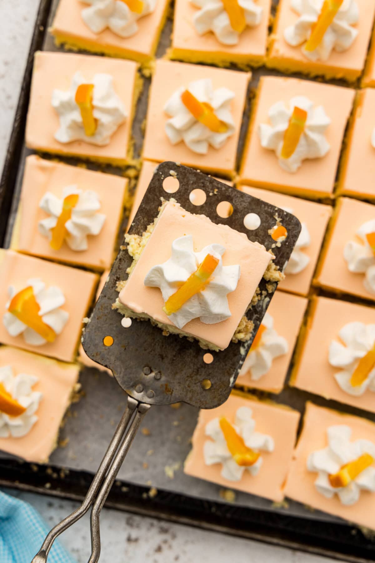 overhead photo of frosty orange dream square on spatula
