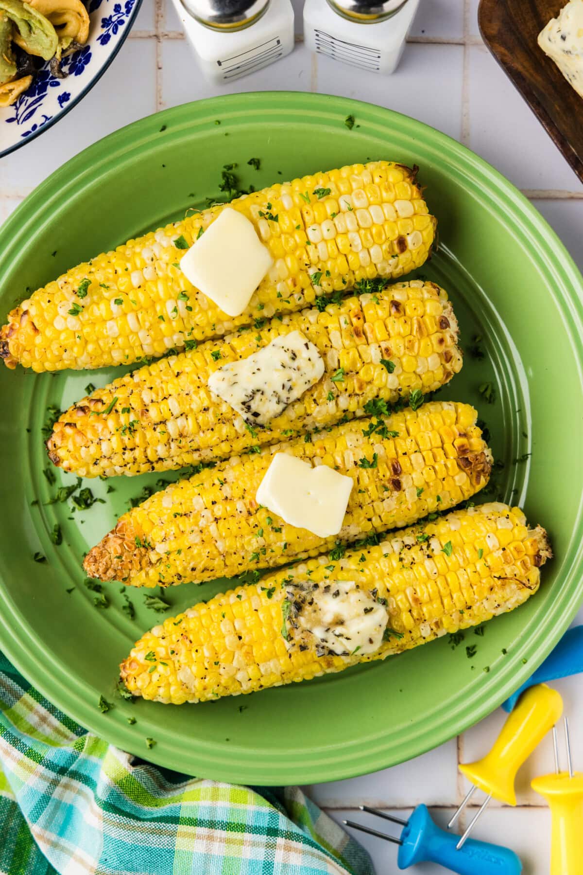 Air Fryer Corn on the Cob on a plate with butter