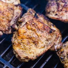close up of chicken thighs on the grill