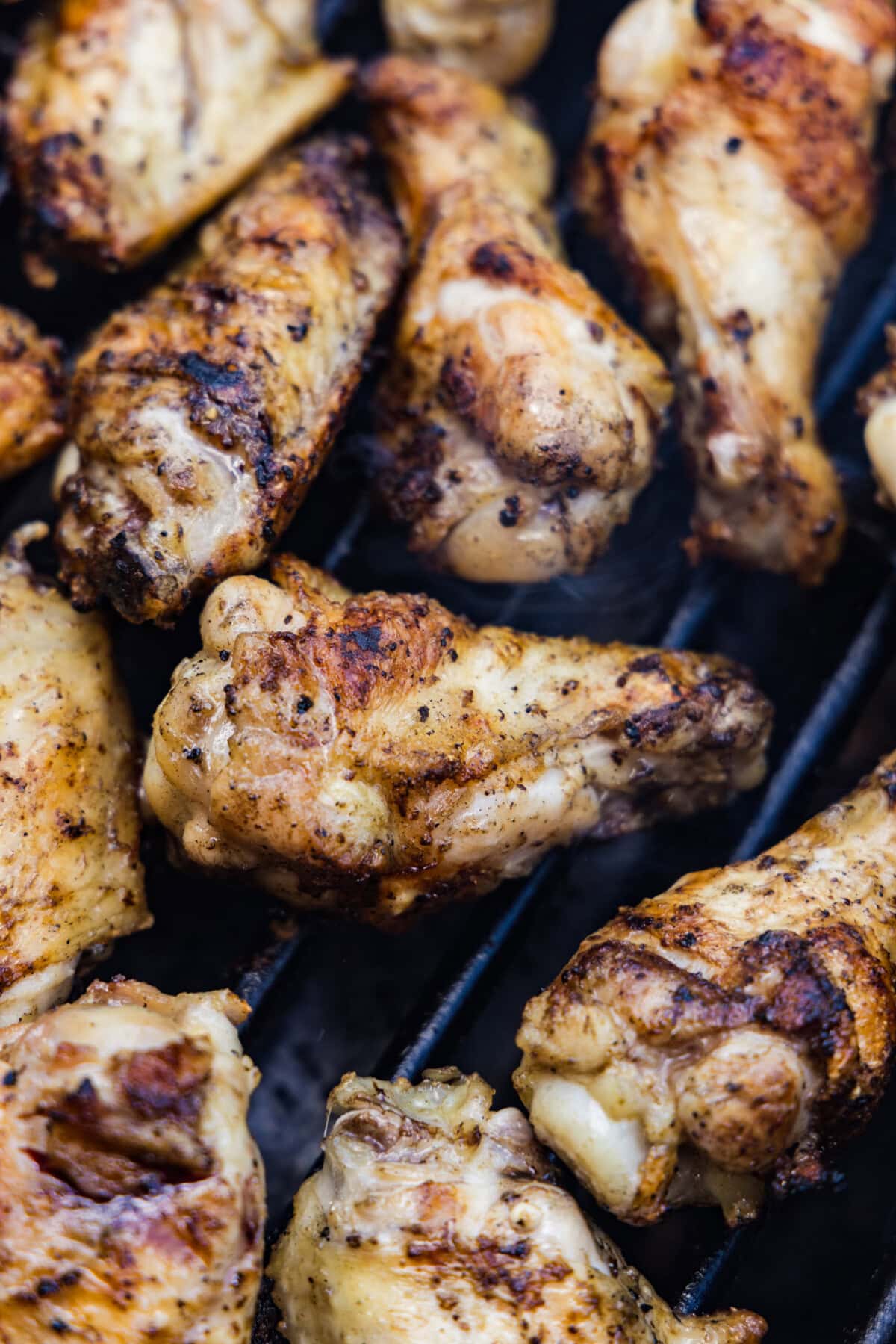 chicken wings cooking on the grill