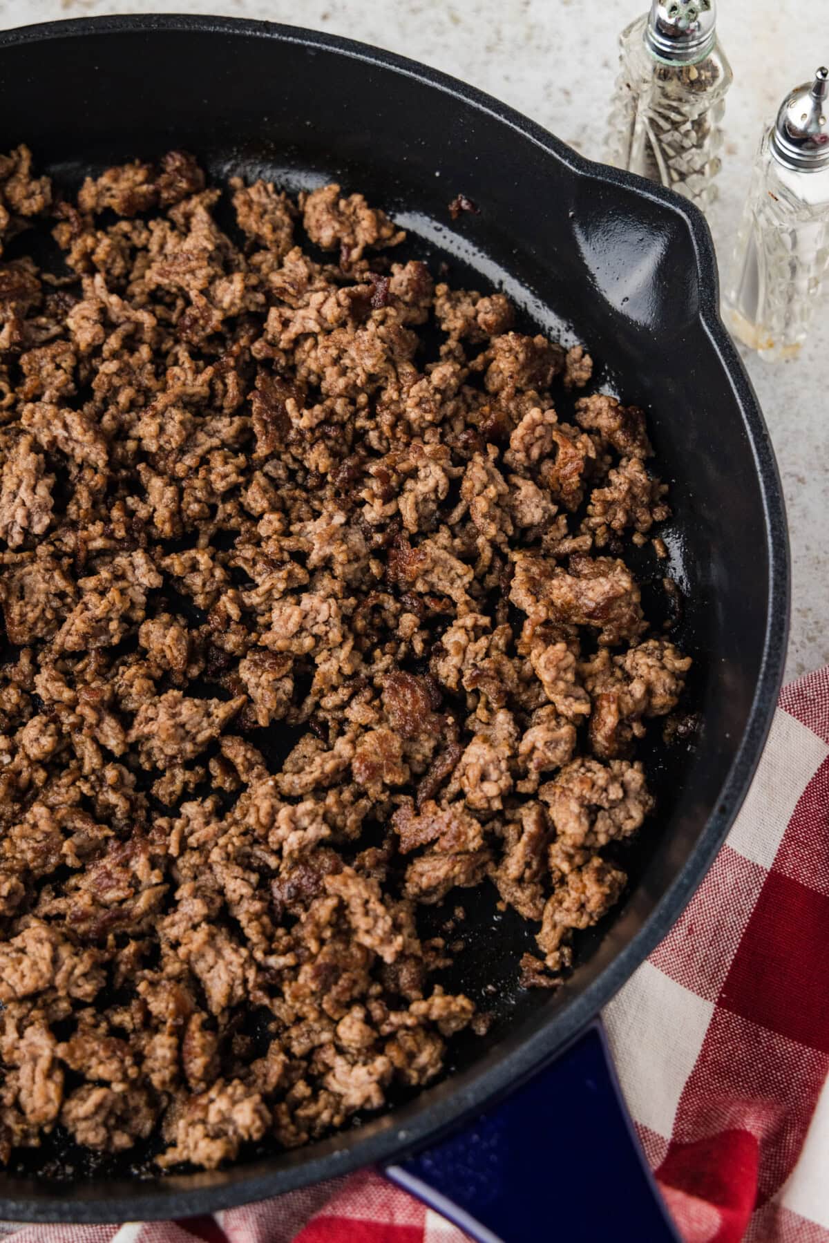 half a skillet of properly browned ground beef ready to use