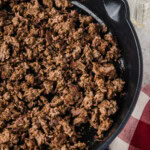photo showing half of a skillet of browned ground beef
