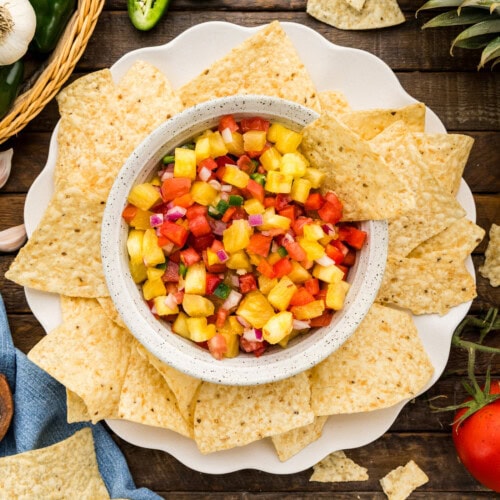 Pineapple Salsa in serving bowl surrounded by chips