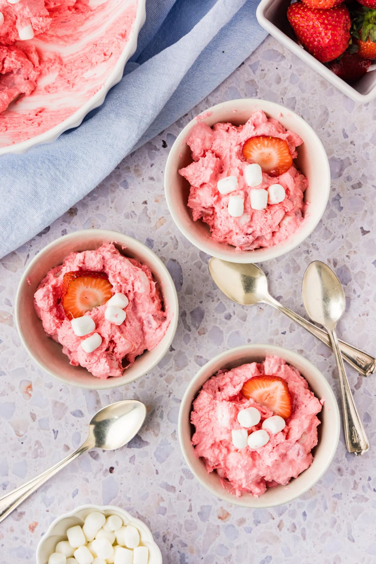 three small bowls of Strawberry Fluff Salad