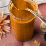 spoon resting on top of jar with Homemade Baja Citrus Marinade in it