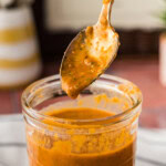spoon lifting out some Baja Marinade from jar