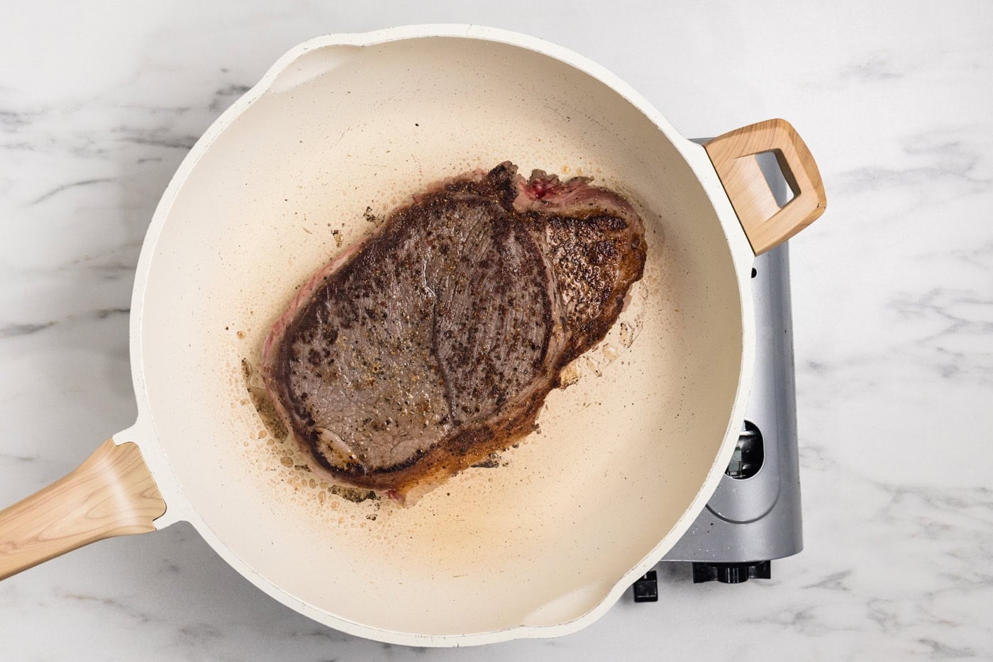 browned chuck roast in skillet