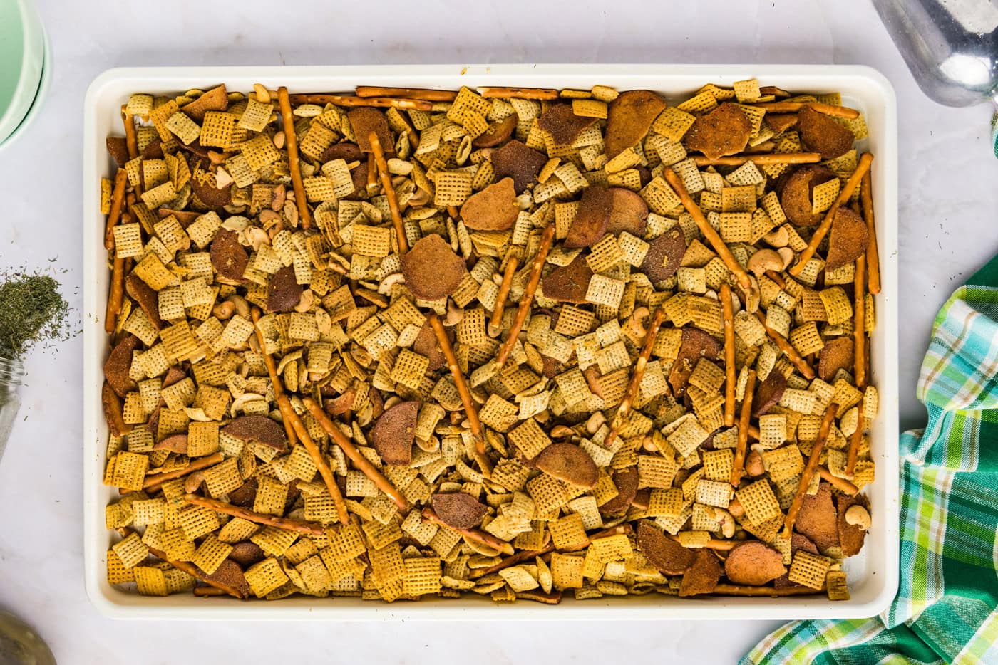 baked dill pickle Chex mix on a baking pan