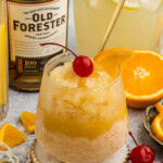 glass of Easy Bourbon Slush with a cherry garnish