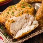 whole smoked chicken in tray tht has been sliced into