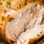 close up of sliced smoked beer can chicken
